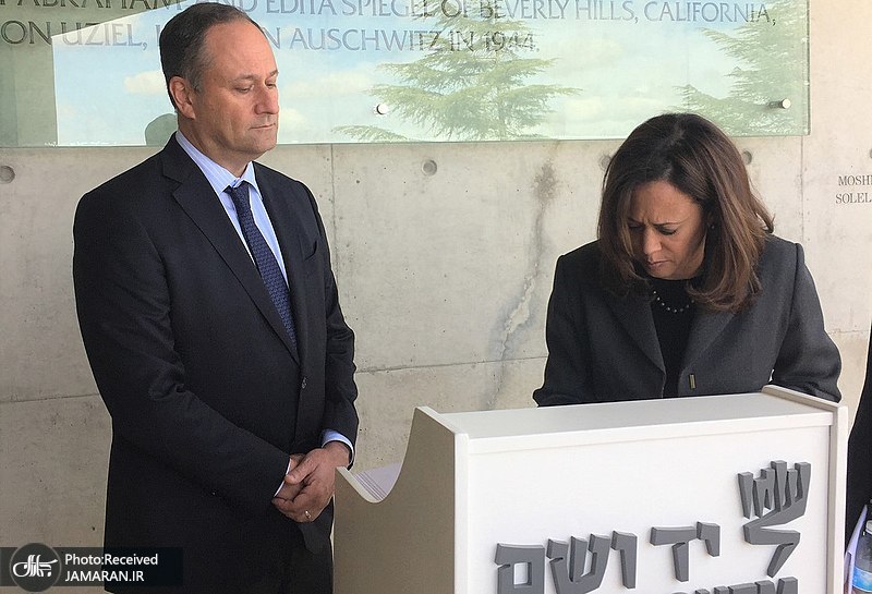 800px-Kamala_Harris_signing_the_guest_book_at_Yad_Vashem_with_her_husband__Doug24830055418_5323ea6526_h_(cropped2)