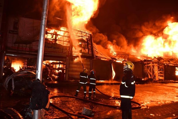 آتش سوزی بزرگ در بغداد/ مغازه‌ها در منطقه طالبیه سوختند + عکس و فیلم