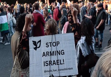 German activists chain themselves to railway tracks to protest arms sales to Israel