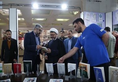 Head of institute visits stall displaying Imam's books and works at International Book Exhibition in Tehran